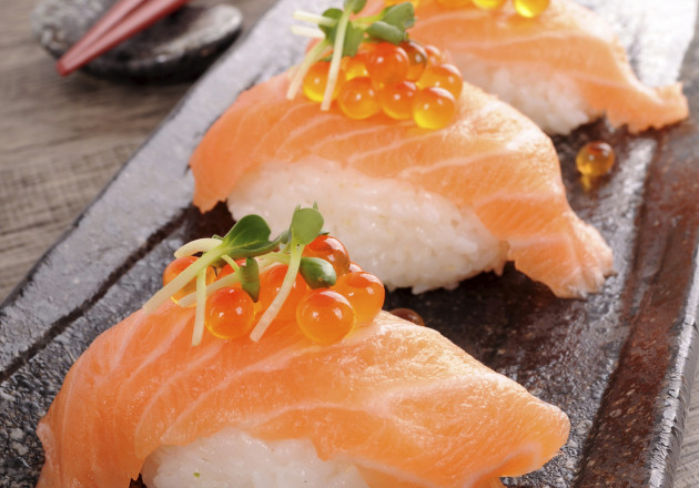 Sushi has become common fare for Americans, with California and salmon rolls being the most popular. However, salmon was not considered an acceptable fish for sushi until the 1980s when the Norwegian fish industry had an excess and persuaded Japanese sushi chefs to try it. Until then, salmon was considered too bland to be eaten raw.
					