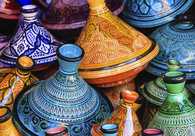 A tagine is a clay pot with a conical lid that is used to slow cook a stew with spiced meat. Don’t have a tagine? A Dutch oven works as well.
					